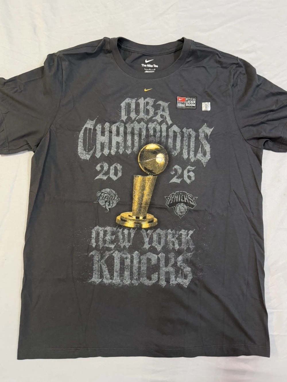 Nike Black New York Knicks NBA Champions Graphic Tee with Gold Trophy